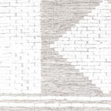 Close-up of the Junction Carpet, a hand-woven wool rug with a light beige and brown brick-like pattern. Swatch