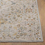 Close-up of the Kabungahan Oushak Style Floral Rug. Cream rug with brick red, denim, and mustard floral pattern. Front