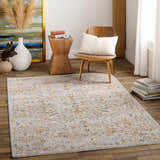 Living room scene with a Kabungahan Oushak Style Floral Rug in cream, light brown, and mustard. Wood floors, chair, and side table. Roomscene-Rectangle