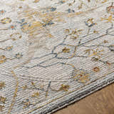 Close-up of the Kabungahan Oushak Style Floral Rug. Features brick red, cream, denim, and mustard floral pattern. Texture