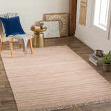 Living room scene with Kalinga Red/Cream Flatweave Wool Rug, chair with blue pillow, gold side table, and neutral wall decor. Roomscene-Rectangle