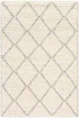 Close-up of the hand-woven Kanopolis Carpet. Cream wool rug with a contemporary gray diamond pattern. Viscose and wool blend. Design-Rectangle-23