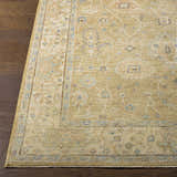 Close-up of the Karalee Handmade Wool Area Rug. Beige, olive, and blue oriental pattern on a hand-knotted wool rug. Front