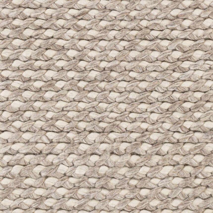 Close-up of the hand woven Keldron Clearance Rug showing charcoal and cream braided wool and viscose texture. Swatch
