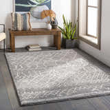 Entryway with a gray Kessingland Area Rug, wood bench, and decorative accents. Roomscene-Rectangle