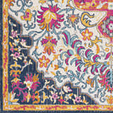 Close up of the Kialla Magenta & Burnt Orange Area Rug showing floral pattern, navy border, and vibrant colors. Swatch