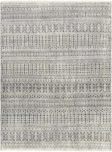 Close-up of the Kiara Area Rug showcasing its black, charcoal, and oatmeal bohemian-inspired geometric pattern. Design-Rectangle-69