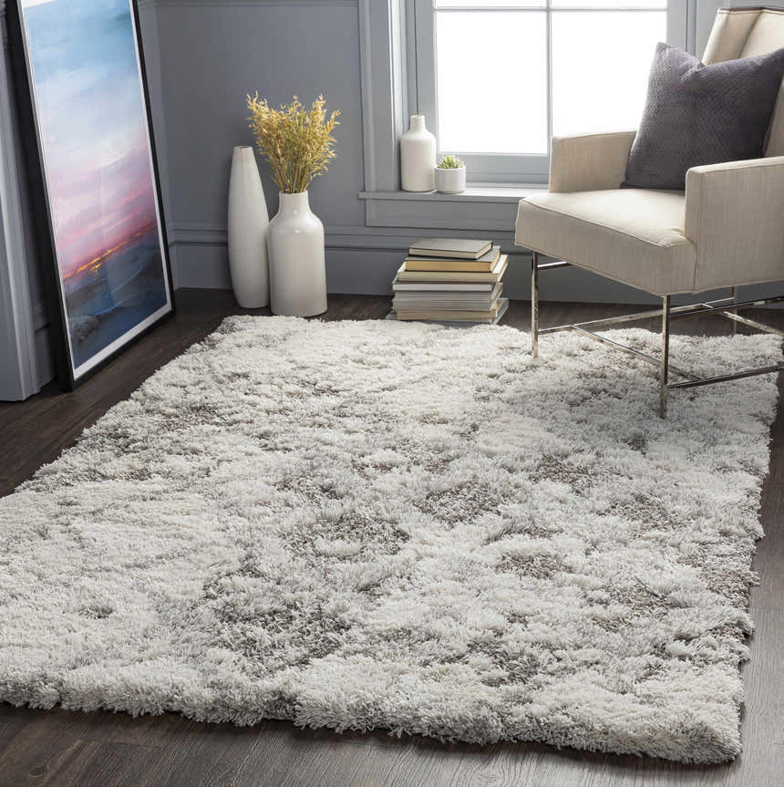 Living room scene with a gray Kilgetty Gray Cloudy Shag Rug, beige chair, and gray walls. Contemporary style. Roomscene-Rectangle
