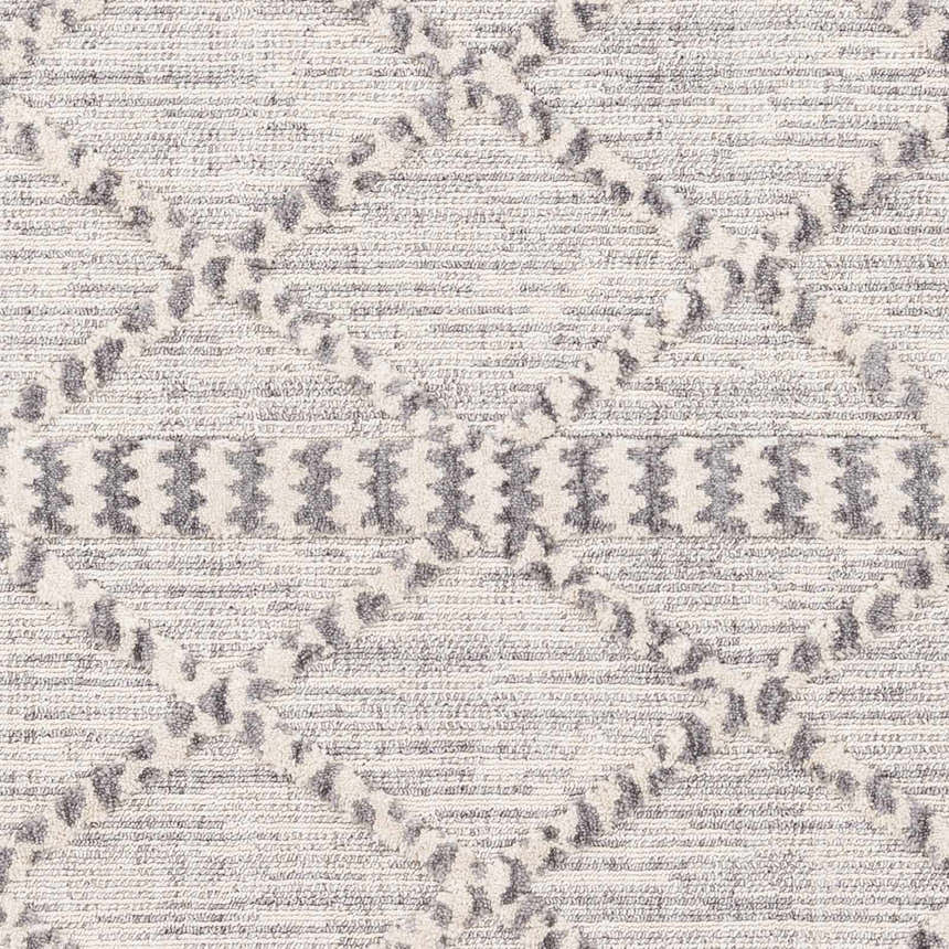 Close-up of Kincheloe Textured 5x7 Carpet. Gray geometric pattern on a textured, off-white polyester rug. Bohemian style. Swatch