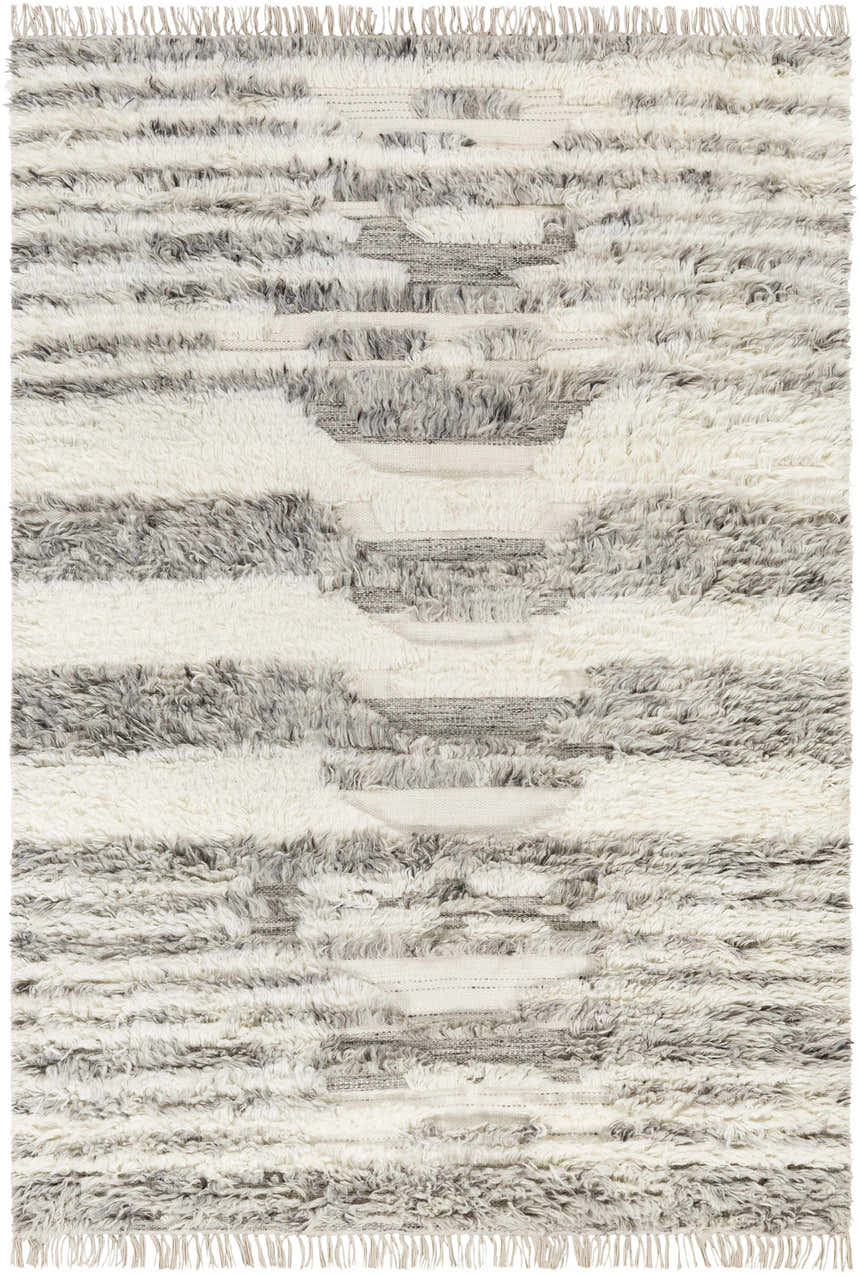 Close-up of the hand woven Kingsthorpe Area Rug. Cream, taupe, and dark brown shag rug with a Moroccan-inspired design. Design-Rectangle-576