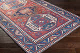 Close-up of the Kodiak Red&Blue Oriental Area Rug showing its traditional pattern, burnt orange, and navy colors. Corner