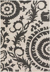 Close-up of the Kongiganak Area Rug. Black floral and paisley pattern on a light beige Olefin rug. Design-Rectangle-5376