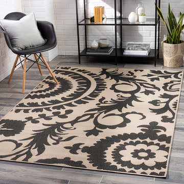 Modern entryway with black chair, shelf, and Kongiganak Area Rug in black and light beige floral pattern. Roomscene-Rectangle