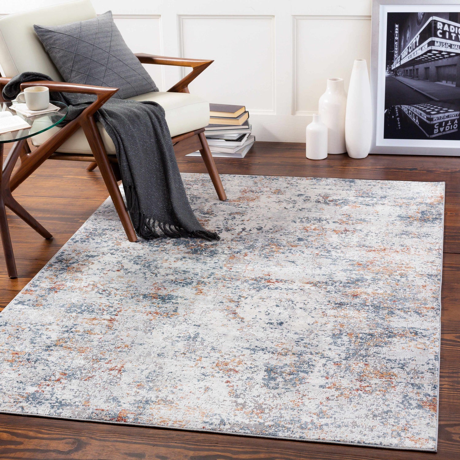 Living room scene with a Kearny Area Rug in brick red, brown, charcoal, light beige, and light gray colors. Roomscene-Rectangle