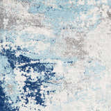Close-up of the Kuluin Area Rug showing its abstract pattern in aqua, charcoal, dark blue, gray, and off-white. Swatch