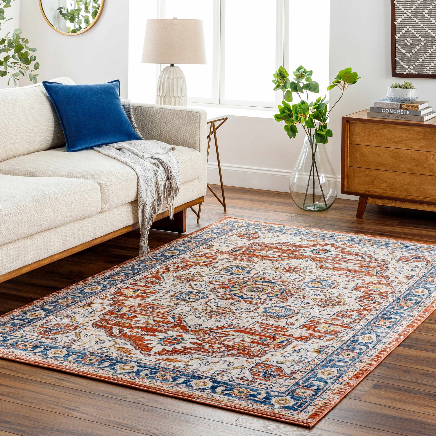 Living room scene with Kuro Traditional Style Rug in beachhouse, dark beige, garnet and nutmeg colors. Roomscene-Rectangle