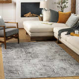 Living room scene with a Kutloanong area rug, cream sectional sofa, gray armchair, and fireplace. Roomscene-Rectangle