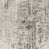 Close-up of the Kutloanong Area Rug. Abstract design in charcoal, gray, and ivory hues. Contemporary style. Swatch