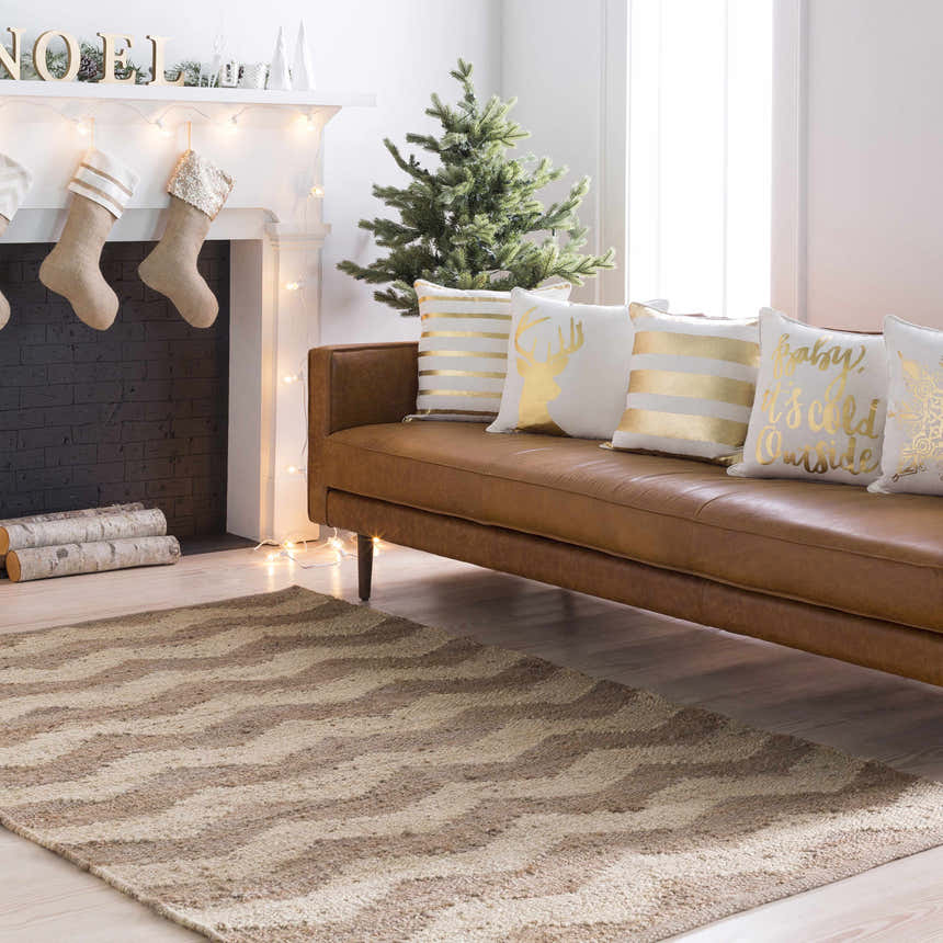 Living room with a brown leather sofa and Ladybank Jute Carpet in beige and tan. Farmhouse Christmas decor. Roomscene-Rectangle