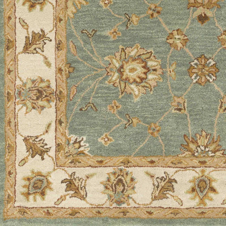 Close-up of the Lagrange Sage Regency Wool Carpet, showcasing its sage green, beige, and brown floral pattern and soft wool texture. Swatch