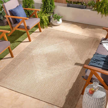 Outdoor patio scene with Hazar Beige Area Rug, wooden chairs, and potted plants. Roomscene-Rectangle