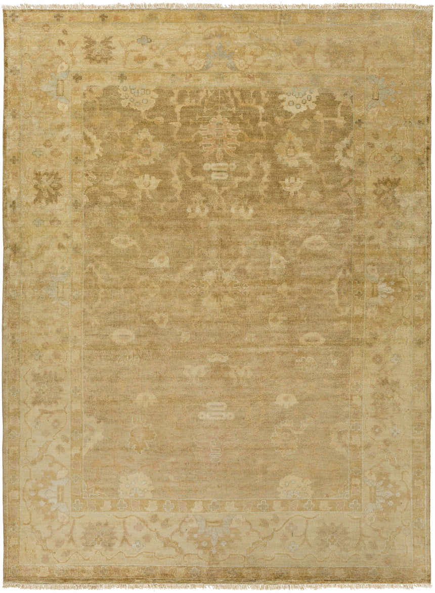 Close-up of the Langhorne Carpet. Hand-knotted wool rug in dusty pink, mustard, slate, and tan with a traditional floral pattern. Design-Rectangle-811