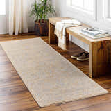 Entryway with a Coby Cream Avant Garde rug, wood bench, plant, and natural light. Warm and inviting. Roomscene-Runner