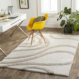 Bright home office with white desk, yellow chair, and the Laya Area Rug, a shag rug with a wavy striped pattern. Roomscene-Rectangle