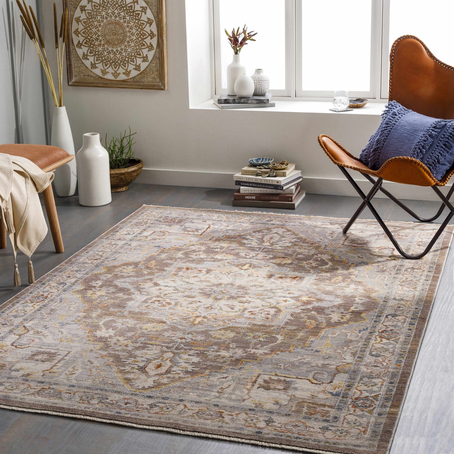 Living room scene with a Bohemian LeChee Area Rug in brick red, burnt orange, cream, and gray tones. Leather chair and decor. Roomscene-Rectangle