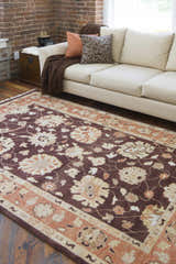 Living room scene with the beige Lenapah Area Rug, a cream sofa, and exposed brick wall. Farmhouse style. Roomscene-Rectangle