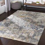 Living room scene with charcoal gray pouf and Lenzburg Faux Silk Abstract Rug in charcoal, gray, light gray, and mustard. Roomscene-Rectangle