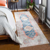 Bedroom scene with a Lake Area Rug runner in blue, coral, and tan. Bohemian style rug on hardwood floors. Roomscene-Runner