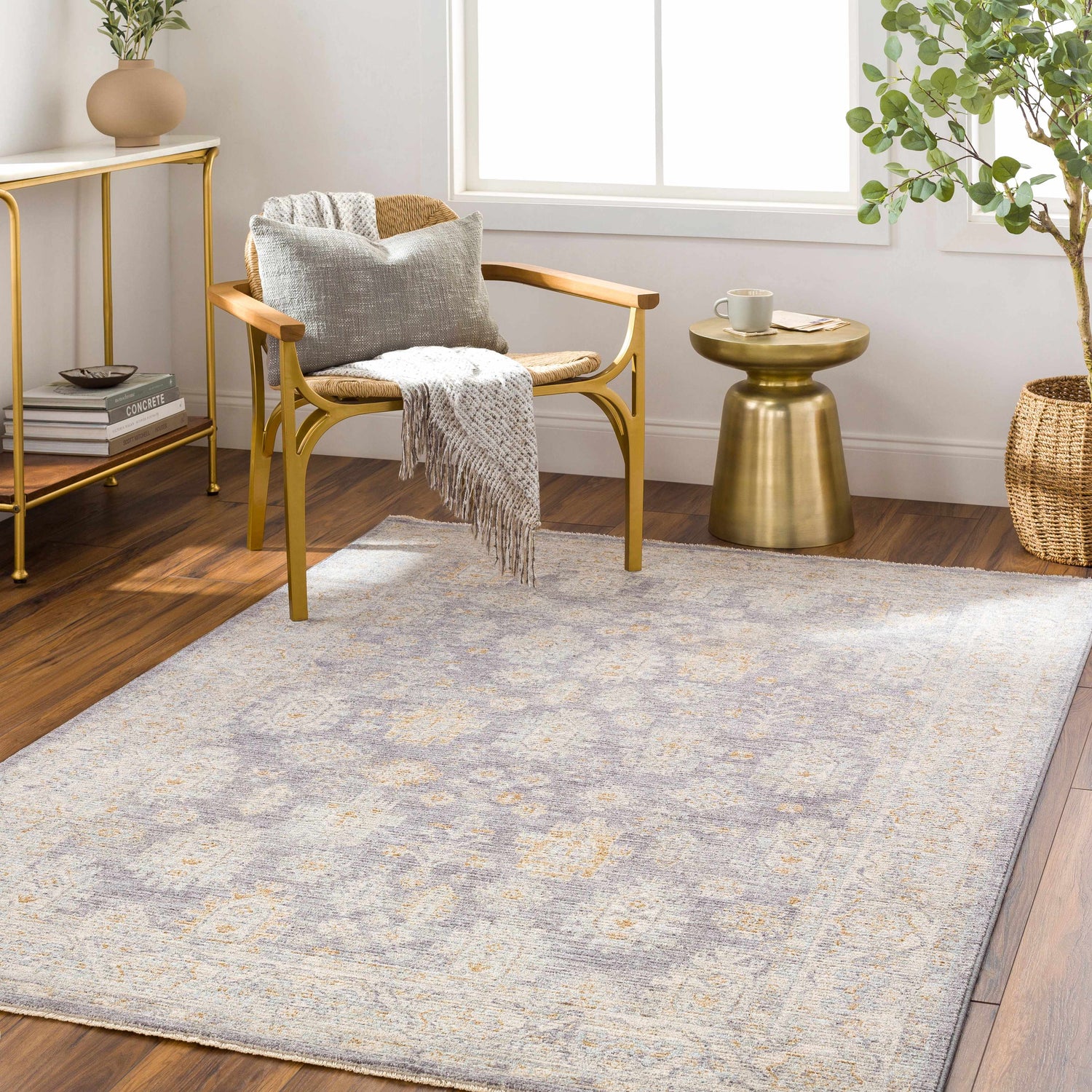 Living room scene with Coby Brown Avant Garde rug, gold accents, wood floors, and natural light. Roomscene-Rectangle