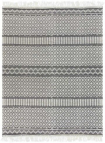 Close-up of the hand-woven Leon Area Rug. Black and white geometric design with fringe. Bohemian, farmhouse style. Design-Rectangle-810