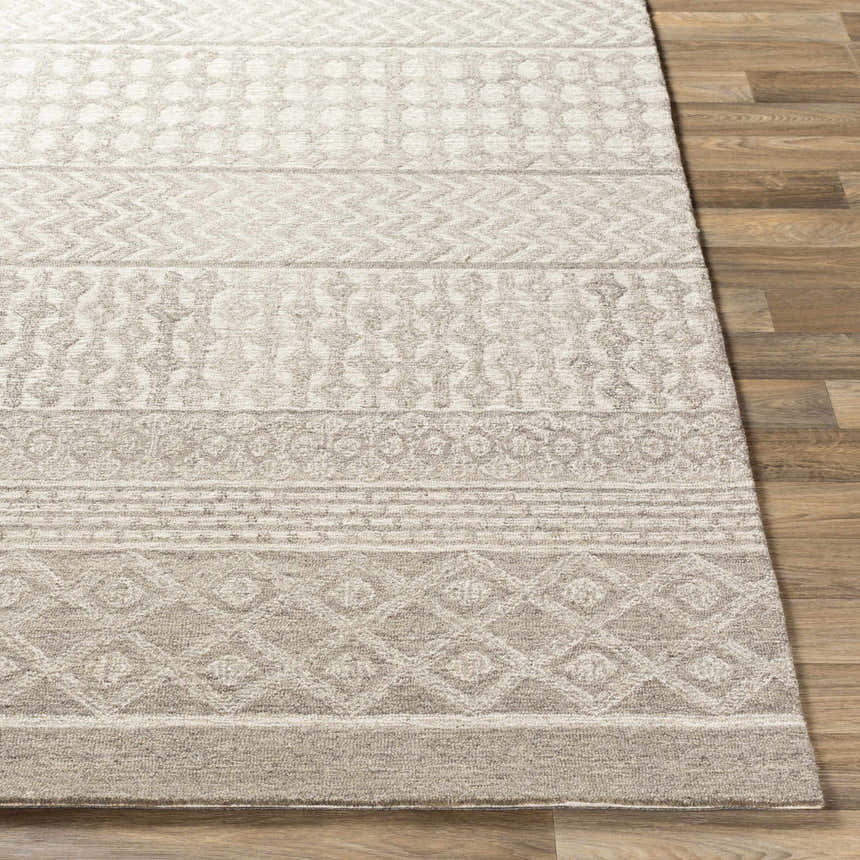 Close-up of the hand-tufted Lone Beige Tufted Maroc Wool Rug showing its geometric pattern and soft texture. Front