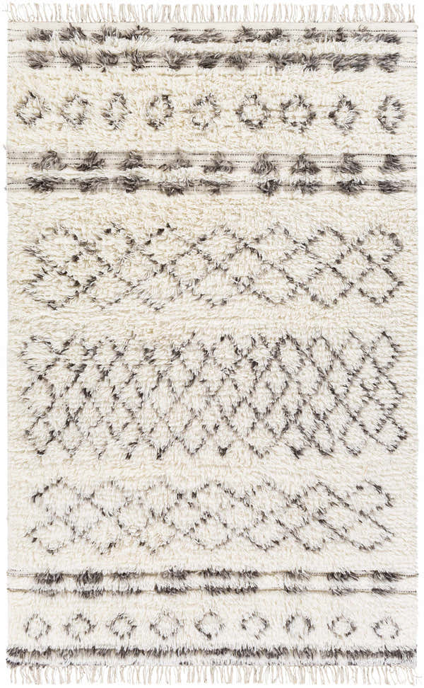 Close-up of the hand-woven Lochwinnoch Area Rug. Beige wool rug with dark brown and gray Moroccan-inspired shag pattern and fringe. Design-Rectangle-576
