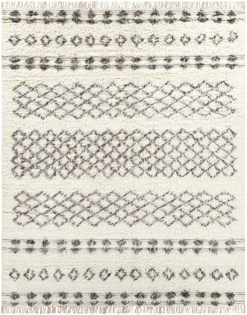 Close-up of the hand woven Lochwinnoch Area Rug. Beige wool rug with gray Moroccan-inspired diamond and dot pattern. Shag texture. Design-Rectangle-810