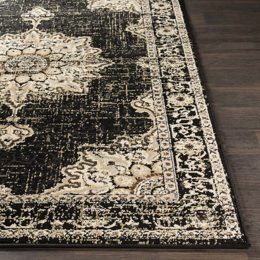 Close-up of the Lostwithiel Black Medallion Rug. Features a traditional, vintage design with black, beige, and brown colors. Front