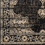Close-up of the Lostwithiel Black Medallion Rug, showing its traditional, vintage design and black and beige color palette. Swatch