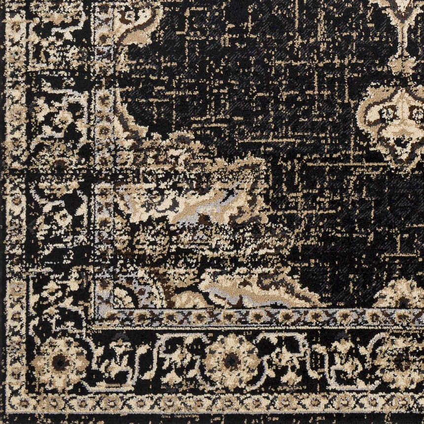 Close-up of the Lostwithiel Black Medallion Rug, showing its traditional, vintage design and black and beige color palette. Swatch