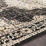 Close-up of the Lostwithiel Black Medallion Rug showing its traditional design, black, beige, and brown colors. Texture