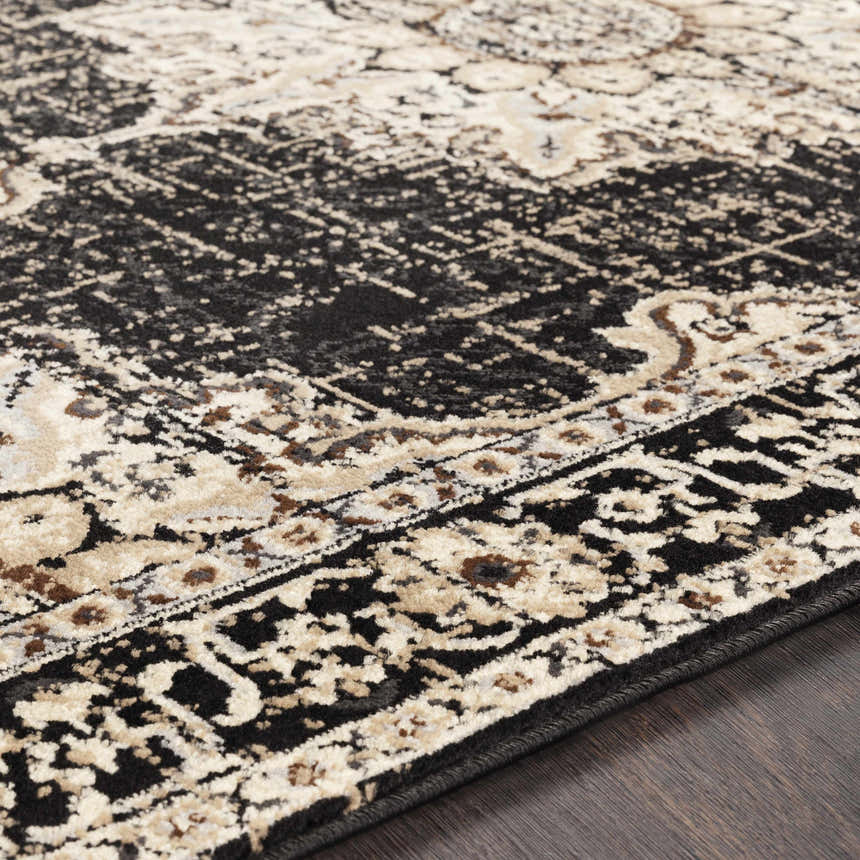 Close-up of the Lostwithiel Black Medallion Rug showing its traditional design, black, beige, and brown colors. Texture