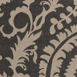 Close-up of Loughton Area Rug showing black background and light brown floral, leaf, and vine pattern. Swatch