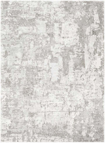 Close-up of the Elsa Area Rug, a contemporary design in black, gray, and ivory polypropylene with an abstract pattern. Design-Rectangle-5373