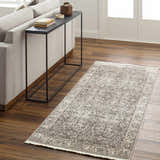 Living room scene with a Lugo Luxe Area Rug in charcoal and ivory, styled with a sofa and console table. Roomscene-Runner
