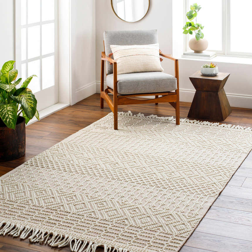 Living room scene with a cloud gray Luyu Area Rug, gray chair, and wood accents. Roomscene-Rectangle