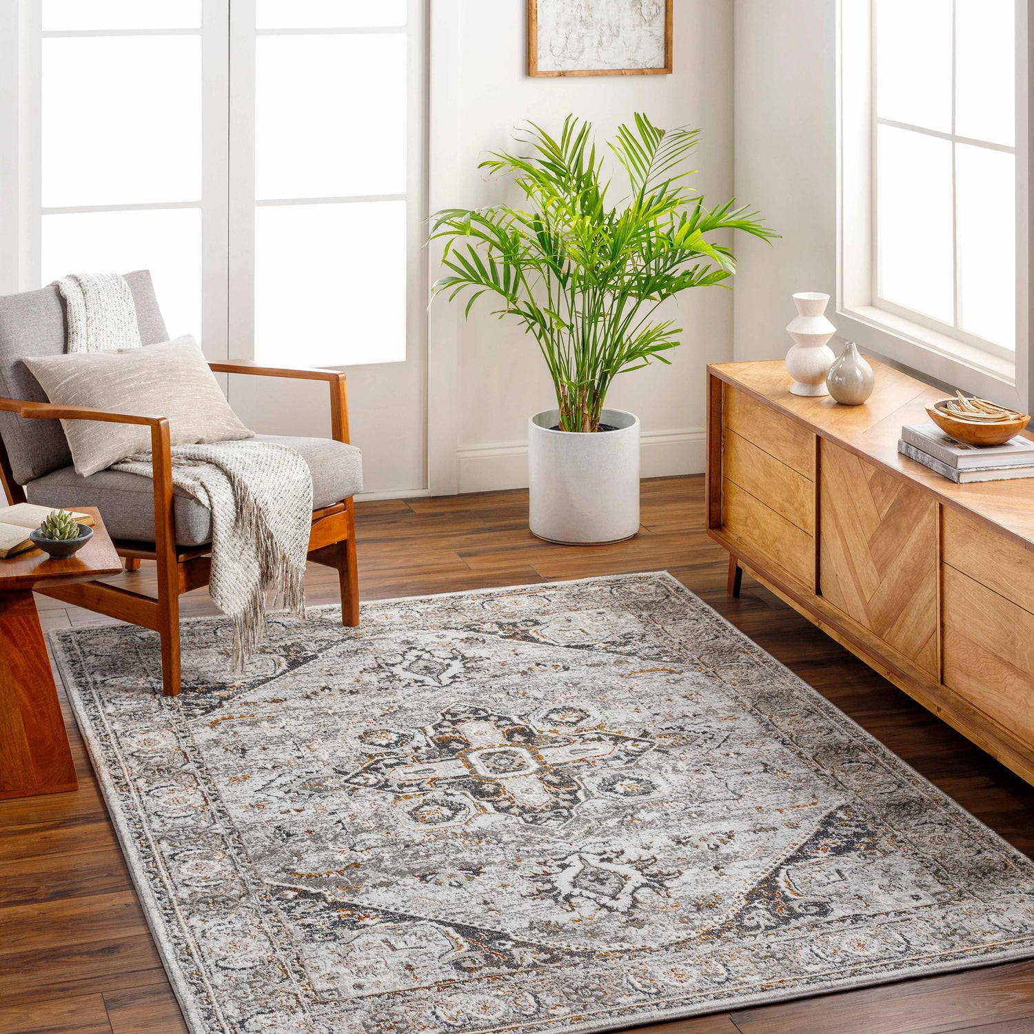 Living room scene with a Liverpool Dark Gray Area Rug, gray chair, and wooden console table. Roomscene-Rectangle