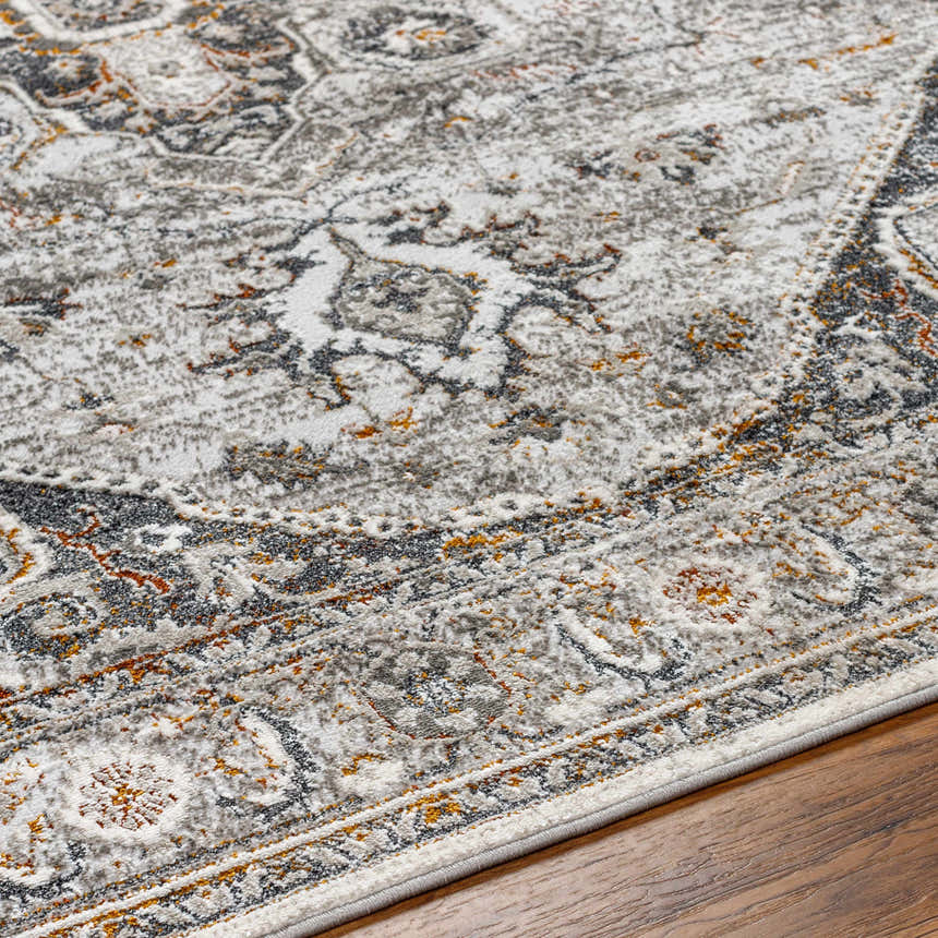 Close-up of the Liverpool Dark Gray Area Rug showing its traditional charcoal, gray, rust, and off-white pattern and soft texture. Texture