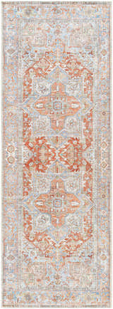 Close-up of the Rust Maayon Washable Rug, a traditional rug with brick red, blue, and sage green oriental-inspired patterns. Design-Runner-2773