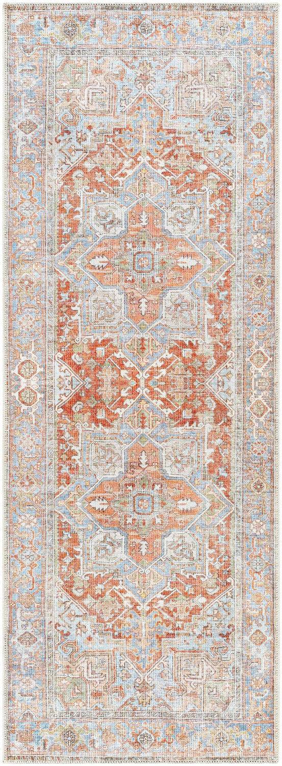 Close-up of the Rust Maayon Washable Rug, a traditional rug with brick red, blue, and sage green oriental-inspired patterns. Design-Runner-2773